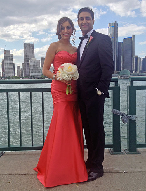best man (hubby) + maid of honor (me) in front of the detroit skyline