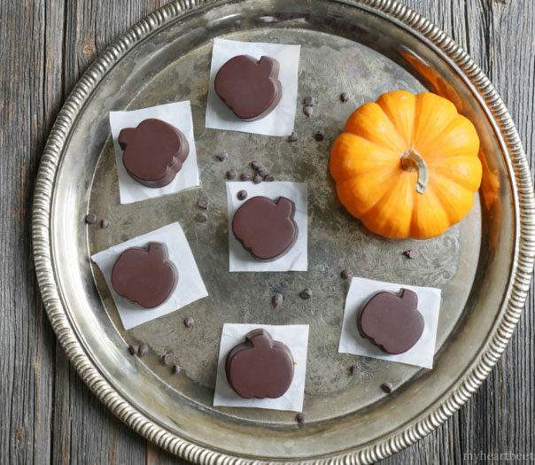 Chocolate Pumpkin Butter Cups made with a creamy spiced pumpkin sunbutter filling (dairy-free and paleo) by Ashley of MyHeartBeets.com