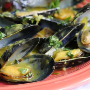 mussels in a mango and white wine sauce